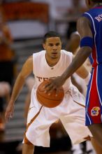 UT sophomore D.J. Augustin (#14, G) playing defense on KU senior Russell Robinson (#3, Guard).  The University of Texas (UT) Longhorns defeated the University of Kansas Jayhawks 72-69 in Austin, Texas on Monday, February 11, 2008.

Filename: SRM_20080211_2121307.jpg
Aperture: f/2.8
Shutter Speed: 1/800
Body: Canon EOS 20D
Lens: Canon EF 300mm f/2.8 L IS