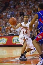 UT junior A.J. Abrams (#3, G) playing defense against a Kansas player.  The University of Texas (UT) Longhorns defeated the University of Kansas Jayhawks 72-69 in Austin, Texas on Monday, February 11, 2008.

Filename: SRM_20080211_2133325.jpg
Aperture: f/2.8
Shutter Speed: 1/640
Body: Canon EOS-1D Mark II
Lens: Canon EF 80-200mm f/2.8 L