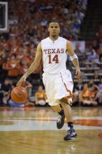 UT junior A.J. Abrams (#3, G) playing defense against a Kansas player.  The University of Texas (UT) Longhorns defeated the University of Kansas Jayhawks 72-69 in Austin, Texas on Monday, February 11, 2008.

Filename: SRM_20080211_2134103.jpg
Aperture: f/2.8
Shutter Speed: 1/640
Body: Canon EOS-1D Mark II
Lens: Canon EF 80-200mm f/2.8 L