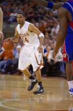 UT junior A.J. Abrams (#3, G) playing defense against a Kansas player.  The University of Texas (UT) Longhorns defeated the University of Kansas Jayhawks 72-69 in Austin, Texas on Monday, February 11, 2008.

Filename: SRM_20080211_2134124.jpg
Aperture: f/2.8
Shutter Speed: 1/640
Body: Canon EOS-1D Mark II
Lens: Canon EF 80-200mm f/2.8 L