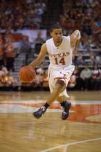 UT junior A.J. Abrams (#3, G) playing defense against a Kansas player.  The University of Texas (UT) Longhorns defeated the University of Kansas Jayhawks 72-69 in Austin, Texas on Monday, February 11, 2008.

Filename: SRM_20080211_2135043.jpg
Aperture: f/2.8
Shutter Speed: 1/640
Body: Canon EOS-1D Mark II
Lens: Canon EF 80-200mm f/2.8 L