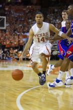 UT junior A.J. Abrams (#3, G) playing defense against a Kansas player.  The University of Texas (UT) Longhorns defeated the University of Kansas Jayhawks 72-69 in Austin, Texas on Monday, February 11, 2008.

Filename: SRM_20080211_2135066.jpg
Aperture: f/2.8
Shutter Speed: 1/640
Body: Canon EOS-1D Mark II
Lens: Canon EF 80-200mm f/2.8 L