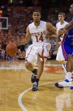 UT sophomore D.J. Augustin (#14, G) makes a drive.  The University of Texas (UT) Longhorns defeated the University of Kansas Jayhawks 72-69 in Austin, Texas on Monday, February 11, 2008.

Filename: SRM_20080211_2135087.jpg
Aperture: f/2.8
Shutter Speed: 1/640
Body: Canon EOS-1D Mark II
Lens: Canon EF 80-200mm f/2.8 L