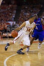 UT sophomore D.J. Augustin (#14, G) makes a drive past KU sophomore Sherron Collins (#4, Guard).  The University of Texas (UT) Longhorns defeated the University of Kansas Jayhawks 72-69 in Austin, Texas on Monday, February 11, 2008.

Filename: SRM_20080211_2142220.jpg
Aperture: f/2.8
Shutter Speed: 1/640
Body: Canon EOS-1D Mark II
Lens: Canon EF 80-200mm f/2.8 L