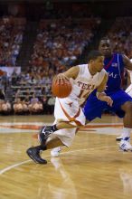 UT sophomore D.J. Augustin (#14, G) makes a drive past KU sophomore Sherron Collins (#4, Guard).  The University of Texas (UT) Longhorns defeated the University of Kansas Jayhawks 72-69 in Austin, Texas on Monday, February 11, 2008.

Filename: SRM_20080211_2142221.jpg
Aperture: f/2.8
Shutter Speed: 1/640
Body: Canon EOS-1D Mark II
Lens: Canon EF 80-200mm f/2.8 L