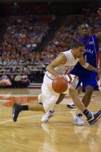 UT sophomore D.J. Augustin (#14, G) makes a drive past KU sophomore Sherron Collins (#4, Guard).  The University of Texas (UT) Longhorns defeated the University of Kansas Jayhawks 72-69 in Austin, Texas on Monday, February 11, 2008.

Filename: SRM_20080211_2142242.jpg
Aperture: f/2.8
Shutter Speed: 1/640
Body: Canon EOS-1D Mark II
Lens: Canon EF 80-200mm f/2.8 L