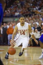 UT junior A.J. Abrams (#3, G) playing defense against a Kansas player.  The University of Texas (UT) Longhorns defeated the University of Kansas Jayhawks 72-69 in Austin, Texas on Monday, February 11, 2008.

Filename: SRM_20080211_2145260.jpg
Aperture: f/2.8
Shutter Speed: 1/640
Body: Canon EOS-1D Mark II
Lens: Canon EF 80-200mm f/2.8 L