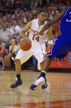 UT junior A.J. Abrams (#3, G) playing defense against a Kansas player.  The University of Texas (UT) Longhorns defeated the University of Kansas Jayhawks 72-69 in Austin, Texas on Monday, February 11, 2008.

Filename: SRM_20080211_2153160.jpg
Aperture: f/2.8
Shutter Speed: 1/640
Body: Canon EOS-1D Mark II
Lens: Canon EF 80-200mm f/2.8 L