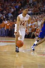 UT junior A.J. Abrams (#3, G) playing defense against a Kansas player.  The University of Texas (UT) Longhorns defeated the University of Kansas Jayhawks 72-69 in Austin, Texas on Monday, February 11, 2008.

Filename: SRM_20080211_2153202.jpg
Aperture: f/2.8
Shutter Speed: 1/640
Body: Canon EOS-1D Mark II
Lens: Canon EF 80-200mm f/2.8 L