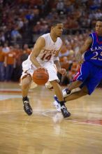 UT junior A.J. Abrams (#3, G) playing defense against a Kansas player.  The University of Texas (UT) Longhorns defeated the University of Kansas Jayhawks 72-69 in Austin, Texas on Monday, February 11, 2008.

Filename: SRM_20080211_2153203.jpg
Aperture: f/2.8
Shutter Speed: 1/640
Body: Canon EOS-1D Mark II
Lens: Canon EF 80-200mm f/2.8 L