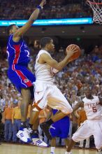 UT sophomore D.J. Augustin (#14, G) takes a shot with KU senior Rodrick Stewart (#5, Guard) on his back.  The University of Texas (UT) Longhorns defeated the University of Kansas Jayhawks 72-69 in Austin, Texas on Monday, February 11, 2008.

Filename: SRM_20080211_2153300.jpg
Aperture: f/2.8
Shutter Speed: 1/640
Body: Canon EOS-1D Mark II
Lens: Canon EF 80-200mm f/2.8 L