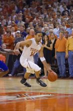 UT junior A.J. Abrams (#3, G) playing defense against a Kansas player.  The University of Texas (UT) Longhorns defeated the University of Kansas Jayhawks 72-69 in Austin, Texas on Monday, February 11, 2008.

Filename: SRM_20080211_2155325.jpg
Aperture: f/2.8
Shutter Speed: 1/640
Body: Canon EOS-1D Mark II
Lens: Canon EF 80-200mm f/2.8 L