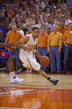 UT junior A.J. Abrams (#3, G) playing defense against a Kansas player.  The University of Texas (UT) Longhorns defeated the University of Kansas Jayhawks 72-69 in Austin, Texas on Monday, February 11, 2008.

Filename: SRM_20080211_2155346.jpg
Aperture: f/2.8
Shutter Speed: 1/640
Body: Canon EOS-1D Mark II
Lens: Canon EF 80-200mm f/2.8 L