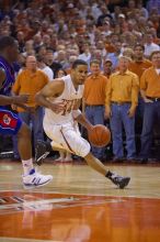 UT junior A.J. Abrams (#3, G) playing defense against a Kansas player.  The University of Texas (UT) Longhorns defeated the University of Kansas Jayhawks 72-69 in Austin, Texas on Monday, February 11, 2008.

Filename: SRM_20080211_2155346.jpg
Aperture: f/2.8
Shutter Speed: 1/640
Body: Canon EOS-1D Mark II
Lens: Canon EF 80-200mm f/2.8 L