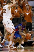 The University of Texas (UT) Longhorns defeated the University of Kansas Jayhawks 72-69 in Austin, Texas on Monday, February 11, 2008.

Filename: SRM_20080211_2155487.jpg
Aperture: f/2.8
Shutter Speed: 1/640
Body: Canon EOS 20D
Lens: Canon EF 300mm f/2.8 L IS