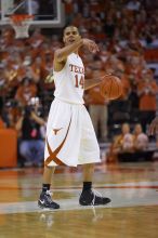 UT junior A.J. Abrams (#3, G) playing defense against a Kansas player.  The University of Texas (UT) Longhorns defeated the University of Kansas Jayhawks 72-69 in Austin, Texas on Monday, February 11, 2008.

Filename: SRM_20080211_2157043.jpg
Aperture: f/2.8
Shutter Speed: 1/640
Body: Canon EOS-1D Mark II
Lens: Canon EF 80-200mm f/2.8 L