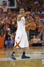 UT junior A.J. Abrams (#3, G) playing defense against a Kansas player.  The University of Texas (UT) Longhorns defeated the University of Kansas Jayhawks 72-69 in Austin, Texas on Monday, February 11, 2008.

Filename: SRM_20080211_2157044.jpg
Aperture: f/2.8
Shutter Speed: 1/640
Body: Canon EOS-1D Mark II
Lens: Canon EF 80-200mm f/2.8 L