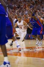 UT junior A.J. Abrams (#3, G) playing defense against a Kansas player.  The University of Texas (UT) Longhorns defeated the University of Kansas Jayhawks 72-69 in Austin, Texas on Monday, February 11, 2008.

Filename: SRM_20080211_2158161.jpg
Aperture: f/2.8
Shutter Speed: 1/640
Body: Canon EOS-1D Mark II
Lens: Canon EF 80-200mm f/2.8 L