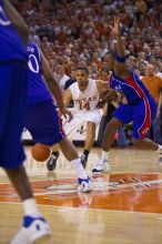 UT junior A.J. Abrams (#3, G) playing defense against a Kansas player.  The University of Texas (UT) Longhorns defeated the University of Kansas Jayhawks 72-69 in Austin, Texas on Monday, February 11, 2008.

Filename: SRM_20080211_2158182.jpg
Aperture: f/2.8
Shutter Speed: 1/640
Body: Canon EOS-1D Mark II
Lens: Canon EF 80-200mm f/2.8 L