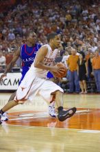 UT junior A.J. Abrams (#3, G) playing defense against a Kansas player.  The University of Texas (UT) Longhorns defeated the University of Kansas Jayhawks 72-69 in Austin, Texas on Monday, February 11, 2008.

Filename: SRM_20080211_2158205.jpg
Aperture: f/2.8
Shutter Speed: 1/640
Body: Canon EOS-1D Mark II
Lens: Canon EF 80-200mm f/2.8 L