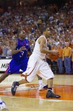 UT junior A.J. Abrams (#3, G) playing defense against a Kansas player.  The University of Texas (UT) Longhorns defeated the University of Kansas Jayhawks 72-69 in Austin, Texas on Monday, February 11, 2008.

Filename: SRM_20080211_2158226.jpg
Aperture: f/2.8
Shutter Speed: 1/640
Body: Canon EOS-1D Mark II
Lens: Canon EF 80-200mm f/2.8 L