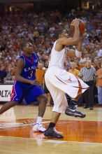 UT sophomore D.J. Augustin (#14, G) takes a shot with KU senior Russell Robinson (#3, Guard) on his back.  The University of Texas (UT) Longhorns defeated the University of Kansas Jayhawks 72-69 in Austin, Texas on Monday, February 11, 2008.

Filename: SRM_20080211_2158227.jpg
Aperture: f/2.8
Shutter Speed: 1/640
Body: Canon EOS-1D Mark II
Lens: Canon EF 80-200mm f/2.8 L