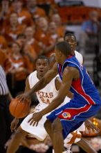 UT sophomore Justin Mason (#24, G) playing defense.  The University of Texas (UT) Longhorns defeated the University of Kansas Jayhawks 72-69 in Austin, Texas on Monday, February 11, 2008.

Filename: SRM_20080211_2159063.jpg
Aperture: f/2.8
Shutter Speed: 1/640
Body: Canon EOS 20D
Lens: Canon EF 300mm f/2.8 L IS