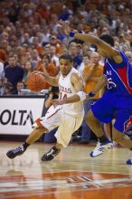 UT sophomore D.J. Augustin (#14, G) drives past KU junior Brandon Rush (#25, Guard) in the Kansas basketball game.  The University of Texas (UT) Longhorns defeated the University of Kansas Jayhawks 72-69 in Austin, Texas on Monday, February 11, 2008.

Filename: SRM_20080211_2159126.jpg
Aperture: f/2.8
Shutter Speed: 1/640
Body: Canon EOS-1D Mark II
Lens: Canon EF 80-200mm f/2.8 L