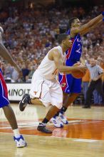 UT sophomore D.J. Augustin (#14, G) drives past KU junior Brandon Rush (#25, Guard) in the Kansas basketball game.  The University of Texas (UT) Longhorns defeated the University of Kansas Jayhawks 72-69 in Austin, Texas on Monday, February 11, 2008.

Filename: SRM_20080211_2159224.jpg
Aperture: f/2.8
Shutter Speed: 1/640
Body: Canon EOS-1D Mark II
Lens: Canon EF 80-200mm f/2.8 L