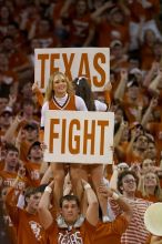 Cheerleaders.  The University of Texas (UT) Longhorns defeated the University of Kansas Jayhawks 72-69 in Austin, Texas on Monday, February 11, 2008.

Filename: SRM_20080211_2204106.jpg
Aperture: f/2.8
Shutter Speed: 1/640
Body: Canon EOS 20D
Lens: Canon EF 300mm f/2.8 L IS