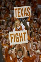 Cheerleaders.  The University of Texas (UT) Longhorns defeated the University of Kansas Jayhawks 72-69 in Austin, Texas on Monday, February 11, 2008.

Filename: SRM_20080211_2204148.jpg
Aperture: f/2.8
Shutter Speed: 1/640
Body: Canon EOS 20D
Lens: Canon EF 300mm f/2.8 L IS