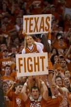 Cheerleaders.  The University of Texas (UT) Longhorns defeated the University of Kansas Jayhawks 72-69 in Austin, Texas on Monday, February 11, 2008.

Filename: SRM_20080211_2204169.jpg
Aperture: f/2.8
Shutter Speed: 1/640
Body: Canon EOS 20D
Lens: Canon EF 300mm f/2.8 L IS