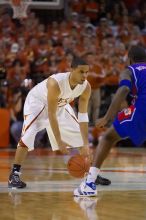 UT junior A.J. Abrams (#3, G) playing defense against a Kansas player.  The University of Texas (UT) Longhorns defeated the University of Kansas Jayhawks 72-69 in Austin, Texas on Monday, February 11, 2008.

Filename: SRM_20080211_2206147.jpg
Aperture: f/2.8
Shutter Speed: 1/640
Body: Canon EOS-1D Mark II
Lens: Canon EF 80-200mm f/2.8 L