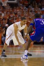 UT junior A.J. Abrams (#3, G) playing defense against a Kansas player.  The University of Texas (UT) Longhorns defeated the University of Kansas Jayhawks 72-69 in Austin, Texas on Monday, February 11, 2008.

Filename: SRM_20080211_2206168.jpg
Aperture: f/2.8
Shutter Speed: 1/640
Body: Canon EOS-1D Mark II
Lens: Canon EF 80-200mm f/2.8 L