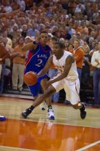 The University of Texas (UT) Longhorns defeated the University of Kansas Jayhawks 72-69 in Austin, Texas on Monday, February 11, 2008.

Filename: SRM_20080211_2209029.jpg
Aperture: f/2.8
Shutter Speed: 1/640
Body: Canon EOS-1D Mark II
Lens: Canon EF 80-200mm f/2.8 L