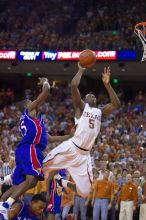 UT sophomore Damion James (#5, G/F) makes a shot as KU junior Mario Chalmers (#15, Guard) attempts to block.  The University of Texas (UT) Longhorns defeated the University of Kansas Jayhawks 72-69 in Austin, Texas on Monday, February 11, 2008.

Filename: SRM_20080211_2209042.jpg
Aperture: f/2.8
Shutter Speed: 1/640
Body: Canon EOS-1D Mark II
Lens: Canon EF 80-200mm f/2.8 L