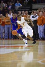 UT junior A.J. Abrams (#3, G) drives past KU senior Russell Robinson (#3, Guard).  The University of Texas (UT) Longhorns defeated the University of Kansas Jayhawks 72-69 in Austin, Texas on Monday, February 11, 2008.

Filename: SRM_20080211_2213545.jpg
Aperture: f/2.8
Shutter Speed: 1/640
Body: Canon EOS-1D Mark II
Lens: Canon EF 80-200mm f/2.8 L