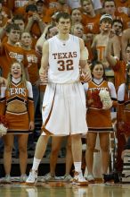 UT junior Connor Atchley (#32, F/C) is significantly taller than the cheerleaders.  The University of Texas (UT) Longhorns defeated the University of Kansas Jayhawks 72-69 in Austin, Texas on Monday, February 11, 2008.

Filename: SRM_20080211_2214026.jpg
Aperture: f/2.8
Shutter Speed: 1/640
Body: Canon EOS 20D
Lens: Canon EF 300mm f/2.8 L IS