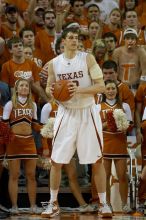 UT junior Connor Atchley (#32, F/C) is significantly taller than the cheerleaders.  The University of Texas (UT) Longhorns defeated the University of Kansas Jayhawks 72-69 in Austin, Texas on Monday, February 11, 2008.

Filename: SRM_20080211_2214100.jpg
Aperture: f/2.8
Shutter Speed: 1/640
Body: Canon EOS 20D
Lens: Canon EF 300mm f/2.8 L IS