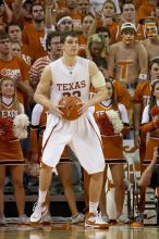 UT junior Connor Atchley (#32, F/C) is significantly taller than the cheerleaders.  The University of Texas (UT) Longhorns defeated the University of Kansas Jayhawks 72-69 in Austin, Texas on Monday, February 11, 2008.

Filename: SRM_20080211_2214121.jpg
Aperture: f/2.8
Shutter Speed: 1/640
Body: Canon EOS 20D
Lens: Canon EF 300mm f/2.8 L IS