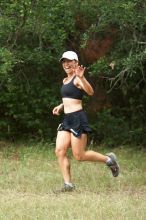 Meredith Terranova running The Saint trail race, sponsored by Rogue, at the Saint Stephen's Episcopal School on Sunday morning, June 29, 2008.

Filename: SRM_20080629_0820045.jpg
Aperture: f/2.8
Shutter Speed: 1/400
Body: Canon EOS 20D
Lens: Canon EF 80-200mm f/2.8 L