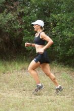 Meredith Terranova running The Saint trail race, sponsored by Rogue, at the Saint Stephen's Episcopal School on Sunday morning, June 29, 2008.

Filename: SRM_20080629_0820108.jpg
Aperture: f/2.8
Shutter Speed: 1/500
Body: Canon EOS 20D
Lens: Canon EF 80-200mm f/2.8 L