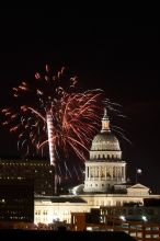 Austin Independence Day fireworks with the Capitol building, as viewed from atop the Manor Garage at The University of Texas at Austin.  The fireworks were launched from Auditorium Shores, downtown Austin, Friday, July 4, 2008.

Filename: SRM_20080704_2138161.jpg
Aperture: f/11.0
Shutter Speed: 10/1
Body: Canon EOS 20D
Lens: Canon EF 80-200mm f/2.8 L