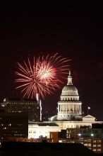 Austin Independence Day fireworks with the Capitol building, as viewed from atop the Manor Garage at The University of Texas at Austin.  The fireworks were launched from Auditorium Shores, downtown Austin, Friday, July 4, 2008.

Filename: SRM_20080704_2139024.jpg
Aperture: f/11.0
Shutter Speed: 6/1
Body: Canon EOS 20D
Lens: Canon EF 80-200mm f/2.8 L