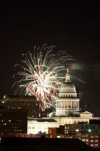 Austin Independence Day fireworks with the Capitol building, as viewed from atop the Manor Garage at The University of Texas at Austin.  The fireworks were launched from Auditorium Shores, downtown Austin, Friday, July 4, 2008.

Filename: SRM_20080704_2139105.jpg
Aperture: f/11.0
Shutter Speed: 6/1
Body: Canon EOS 20D
Lens: Canon EF 80-200mm f/2.8 L