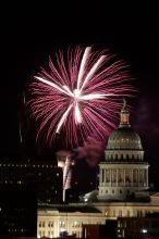 Austin Independence Day fireworks with the Capitol building, as viewed from atop the Manor Garage at The University of Texas at Austin.  The fireworks were launched from Auditorium Shores, downtown Austin, Friday, July 4, 2008.

Filename: SRM_20080704_2154165.jpg
Aperture: f/11.0
Shutter Speed: 2/1
Body: Canon EOS 20D
Lens: Canon EF 80-200mm f/2.8 L