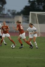 UT freshman Kylie Doniak (#15, Midfielder).  The University of Texas women's soccer team tied 0-0 against the Texas A&M Aggies Friday night, September 27, 2008.

Filename: SRM_20080926_1911203.jpg
Aperture: f/4.0
Shutter Speed: 1/800
Body: Canon EOS-1D Mark II
Lens: Canon EF 300mm f/2.8 L IS