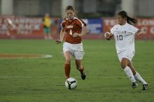 UT senior Jill Gilbeau (#4, Defender and Midfielder).  The University of Texas women's soccer team tied 0-0 against the Texas A&M Aggies Friday night, September 27, 2008.

Filename: SRM_20080926_1922226.jpg
Aperture: f/4.0
Shutter Speed: 1/500
Body: Canon EOS-1D Mark II
Lens: Canon EF 300mm f/2.8 L IS