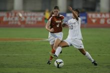 UT senior Jill Gilbeau (#4, Defender and Midfielder).  The University of Texas women's soccer team tied 0-0 against the Texas A&M Aggies Friday night, September 27, 2008.

Filename: SRM_20080926_1922228.jpg
Aperture: f/4.0
Shutter Speed: 1/500
Body: Canon EOS-1D Mark II
Lens: Canon EF 300mm f/2.8 L IS