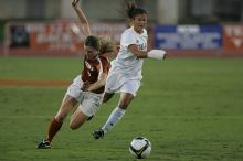 UT senior Jill Gilbeau (#4, Defender and Midfielder).  The University of Texas women's soccer team tied 0-0 against the Texas A&M Aggies Friday night, September 27, 2008.

Filename: SRM_20080926_1922241.jpg
Aperture: f/4.0
Shutter Speed: 1/500
Body: Canon EOS-1D Mark II
Lens: Canon EF 300mm f/2.8 L IS